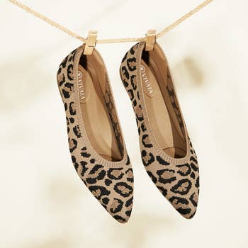 a pair of the knot pointed ballet flats in leopard print