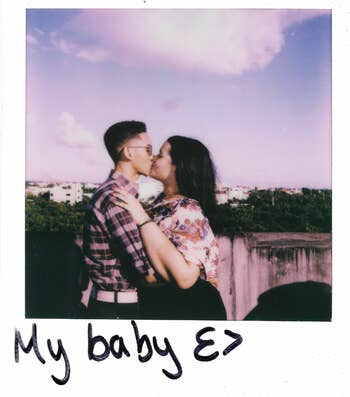 reviewer's polaroid picture of two people kissing with 