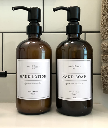 Reviewer image of dispensers for hand lotion and hand soap