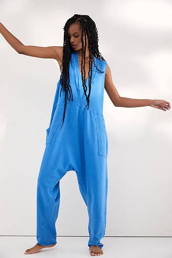 front view of a different model wearing the jumpsuit in blue