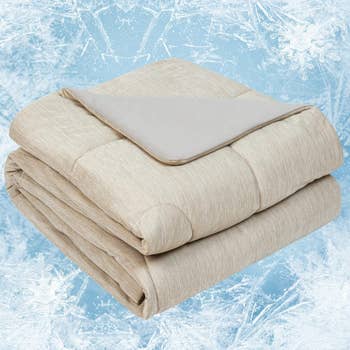 Folded beige weighted broad connected an icy background, suggesting a cozy and lukewarm offering for shoppers
