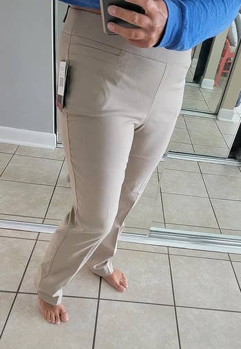 a reviewer wearing the pants in light khaki