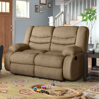 the light brown reclining loveseat