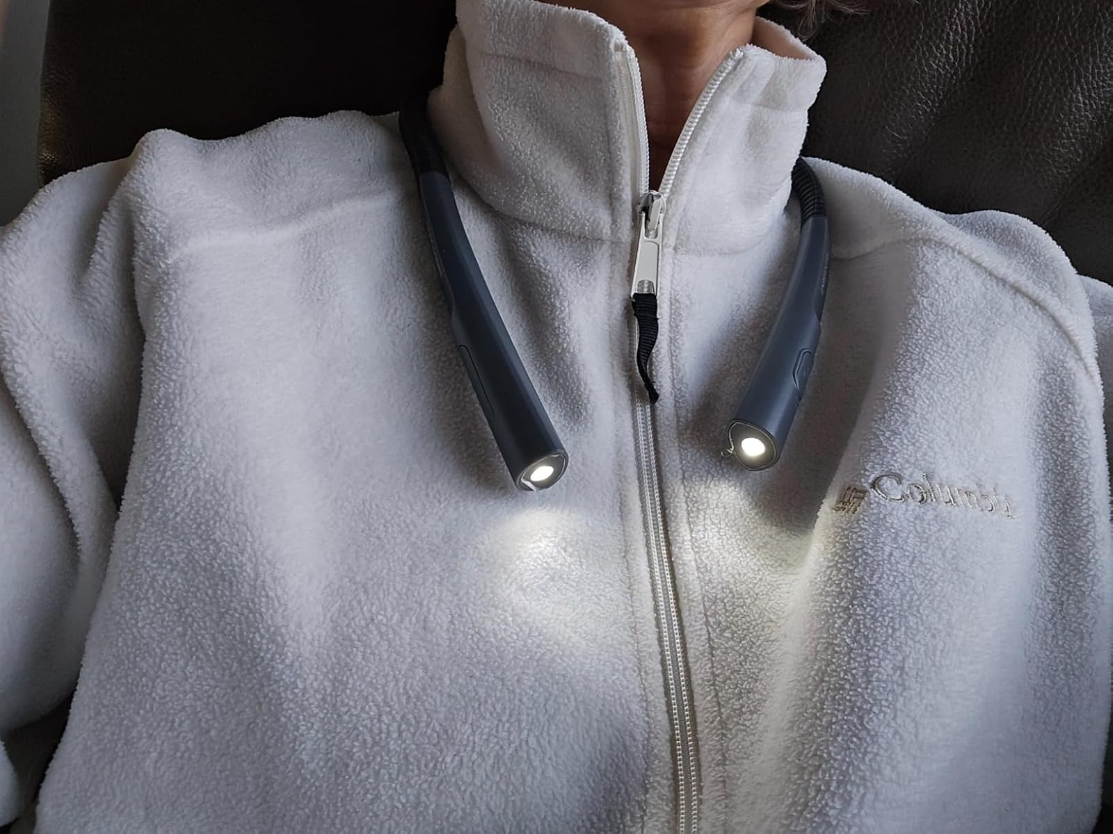 Person wearing a airy  grey  fleece with a neck-worn speechmaking  light, showcasing a cozy and functional accessory for speechmaking  oregon  tasks