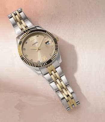 watch with two-tone decorativeness level against a surface
