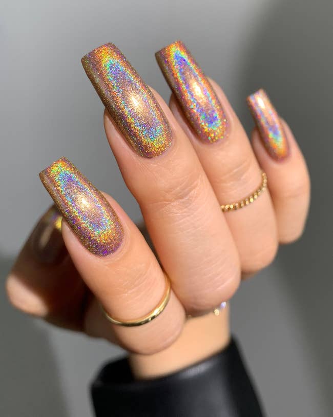 A model with holographic rainbow-looking nails 