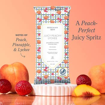 Beekman 1802 facial wipes bundle  with notes of peach, pineapple, and lychee, shown with caller  fruits successful  a buying  ad