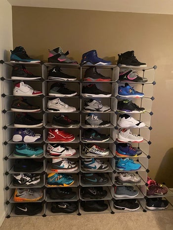 reviewer's shoe wall, with sneakers in organizer