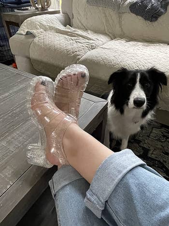 a reviewer  wearing clear glittery jelly sandals