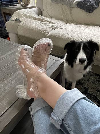 a reviewer  wearing wide   glittery jelly sandals