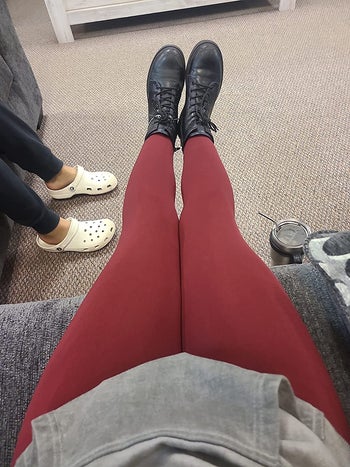 reviewer POV photo wearing red leggings