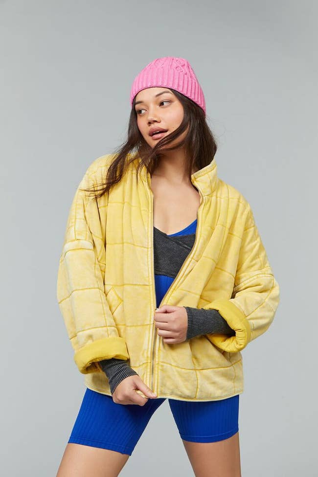 model wearing yellow quilted jacket