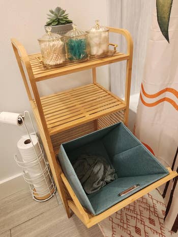 the same shelf with the hamper compartment open