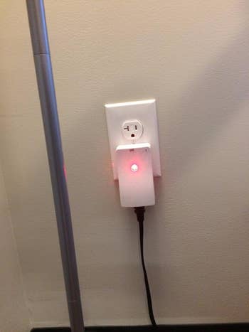 the device plugged into a wall outlet