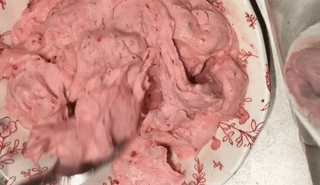 gif of reviewer's fruit soft serve being mixed with spoon