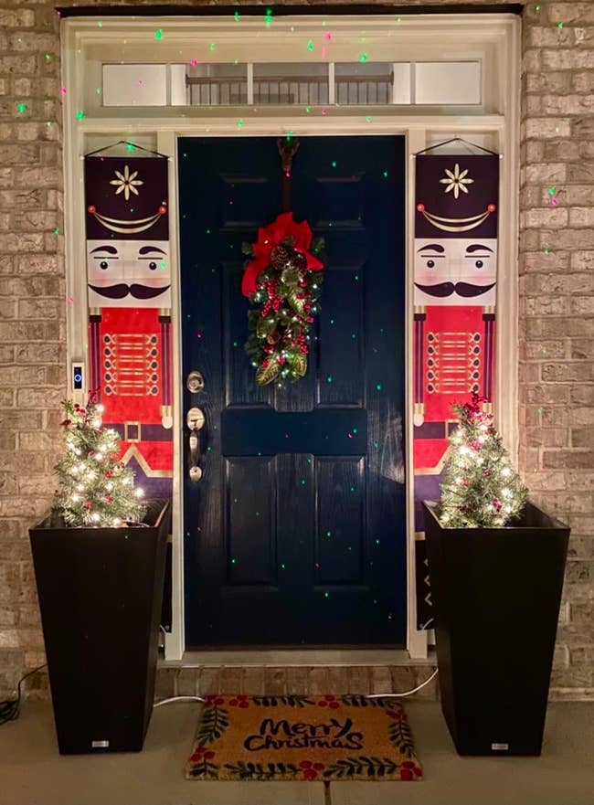 two nutcracker banners on each side of a reviewer's front door