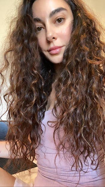 reviewer with long and thick naturally curly hair