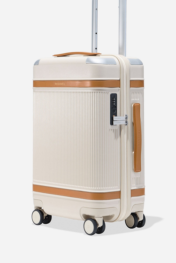 white and brown suitcase