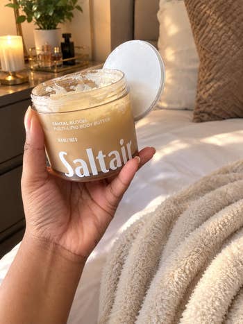 Person holding Saltair Santal Bloom multi-lipid assemblage  butter