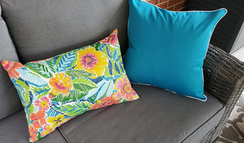 reviewer's aqua and floral covers on pillow inserts