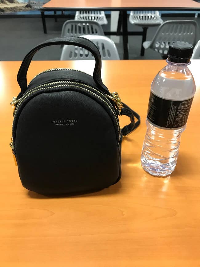 reviewer photo of black mini backpack purse