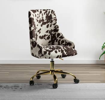 a swivel armchair in a brown animal print 