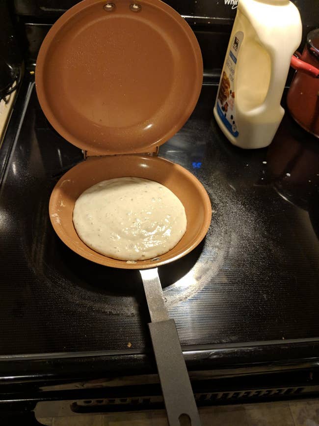 reviewer image of a cooking pancake inside the double pan which is sitting on a stove