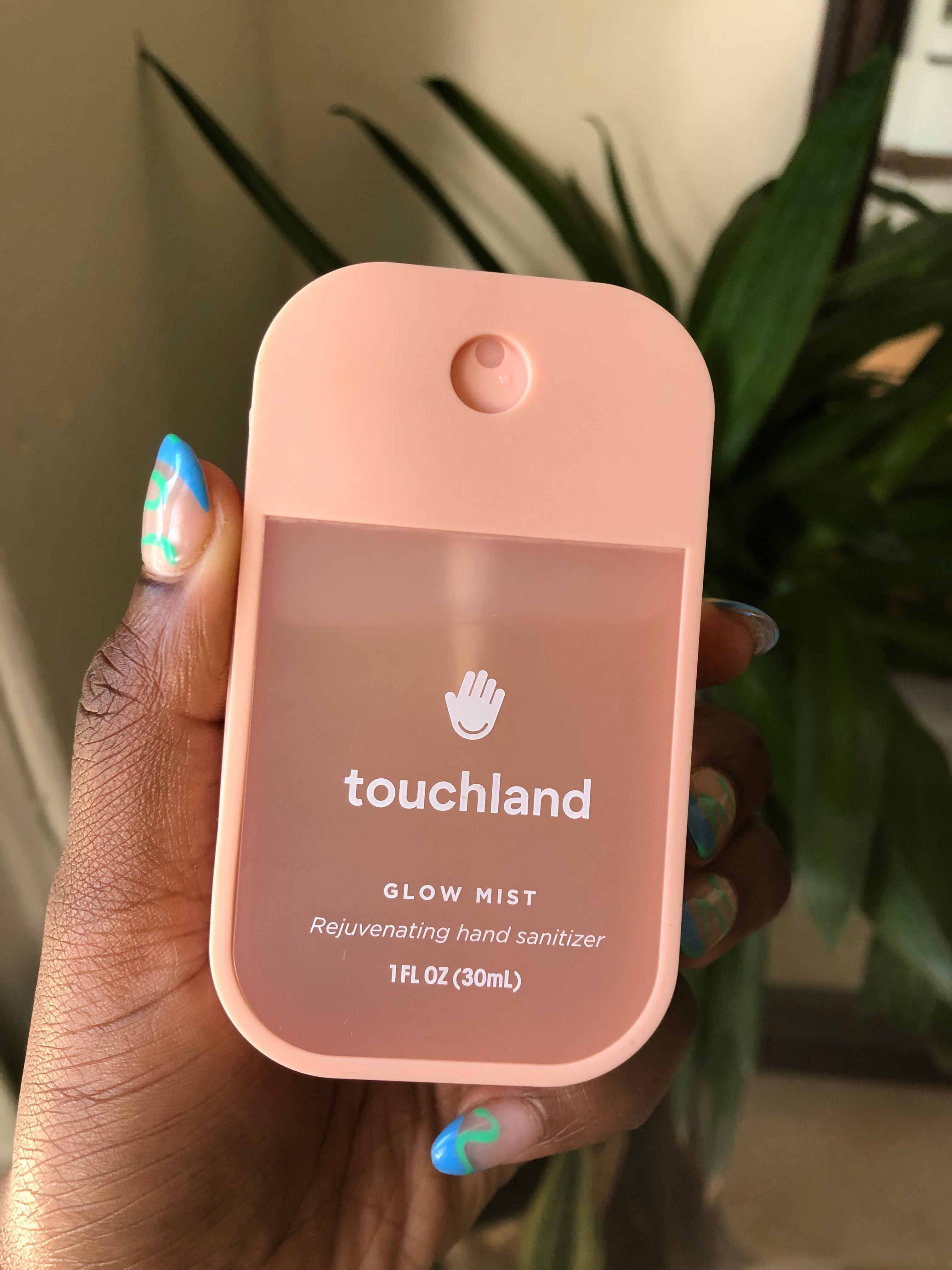 Amanda holding the manus  sanitizer