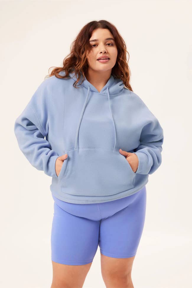 model wearing the sweatshirt in blue