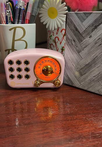 Reviewer's pink speaker on a desk