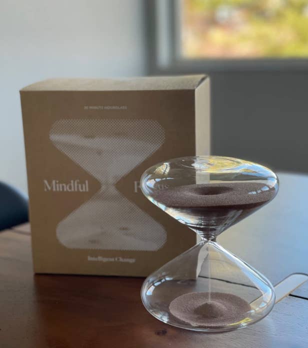 reviewer image of the hourglass in front of packaging 