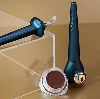the applicator tool and tub of eyeliner