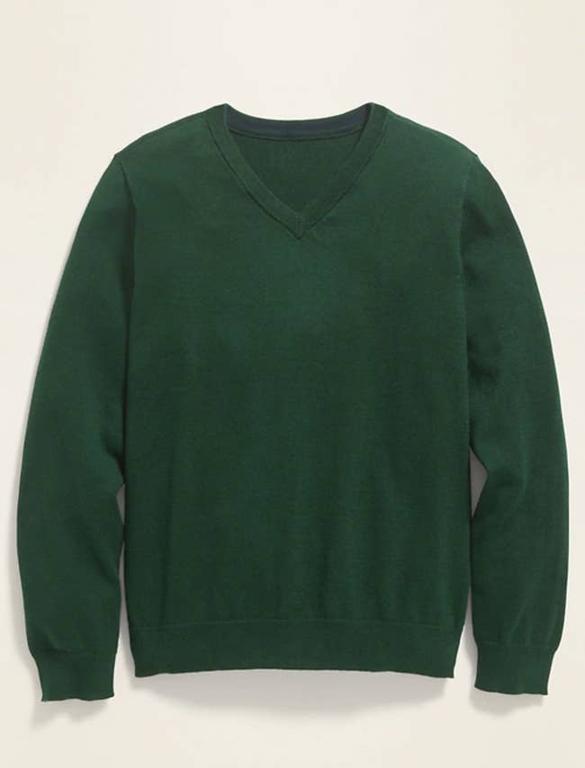a forest green v-neck sweater