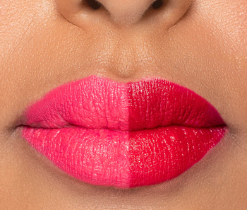 A model with half of their lips pink and the other half red
