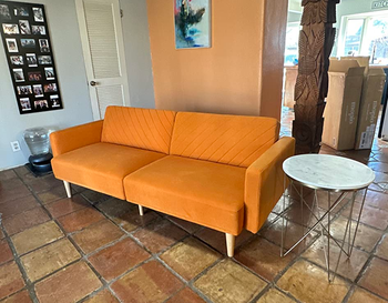 reviewer's orange chevron futon