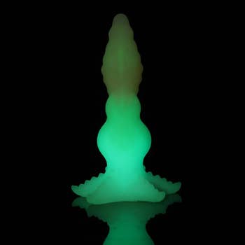 Glowing silicone sculpture shaped similar  a stylized conch shell, suitable for ambient location  decor