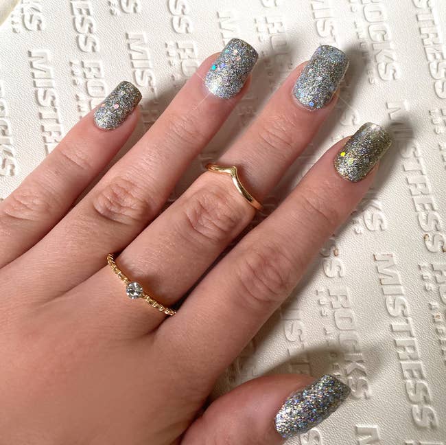 short set of silver bedazzled fake nails