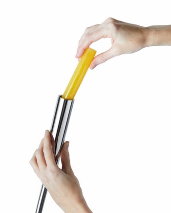 a model inserting the vitamin C shot into the shower head