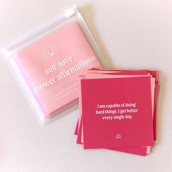 a deck of cards with sayings on them in different shades of pink