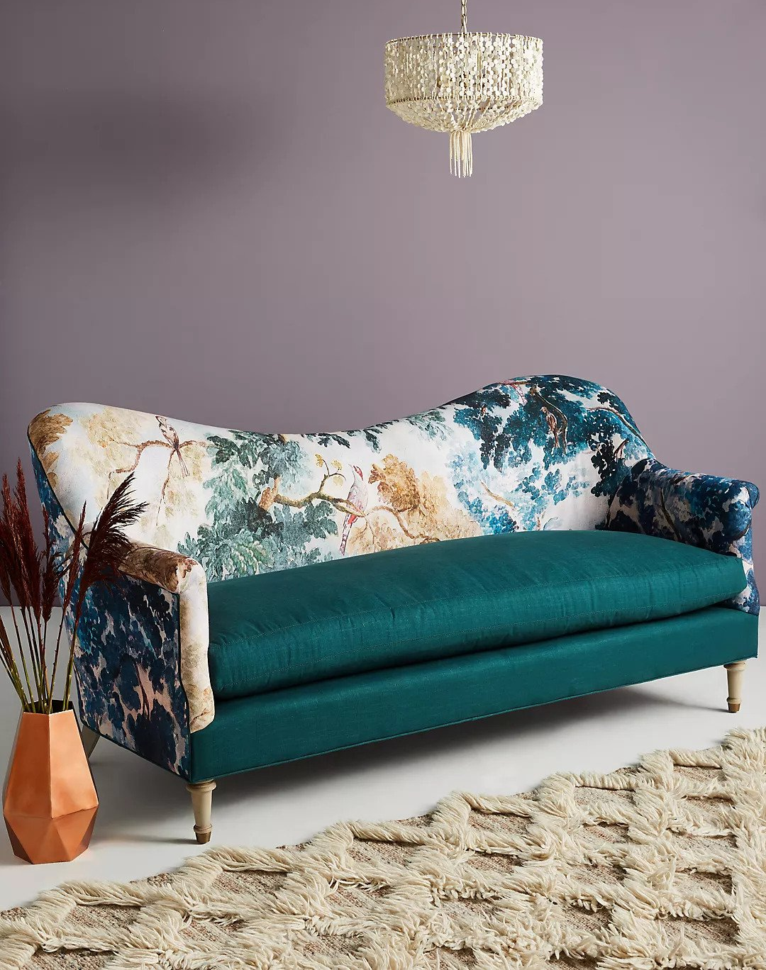 single cushion sofa with decorative back and armrests in painted nature pattern