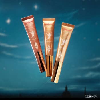 three charlotte tilbury beauty light wands with tinker bell on each tube