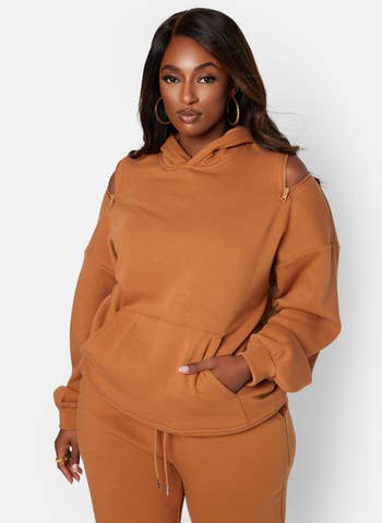 model wearing the hoodie in orange