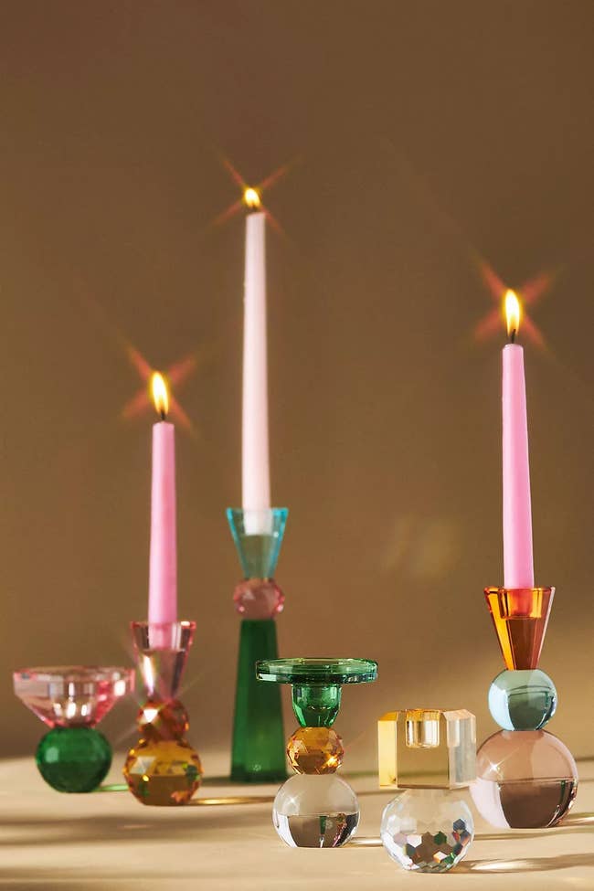 Lit candles in decorative holders suitable for elegant home decor