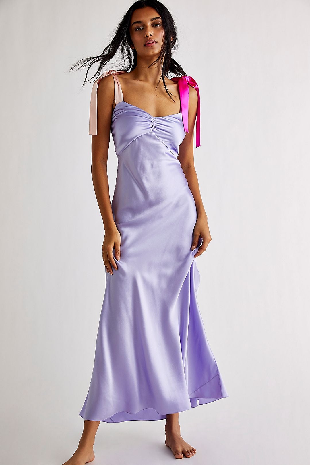 model wearing the lavender silk dress, which has one light pink silk strap and one dark pink silk strap