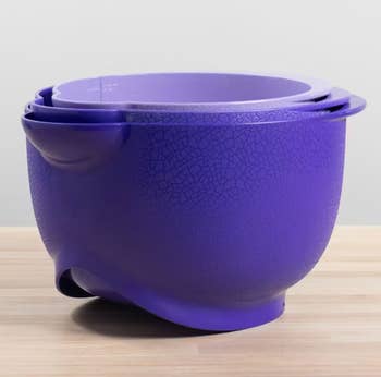 Three bowls in different shades of purple stacked together