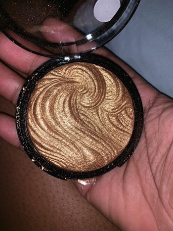 Reviewer holding product in hand