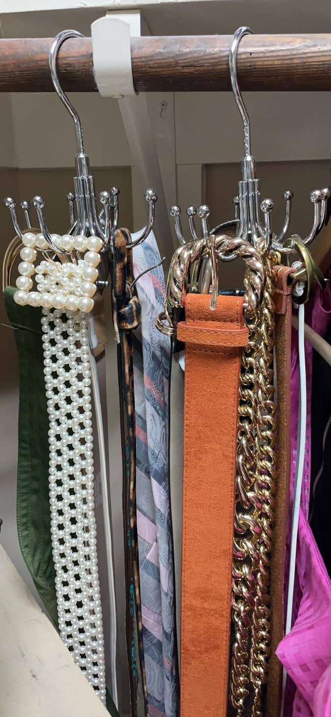 Various belts hanging connected  organizer