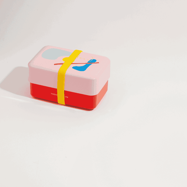 gif of the pink and red abstract bento box with a yellow strap being disassembled 