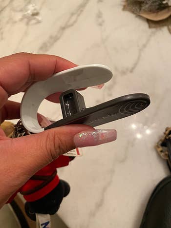 reviewer holding the tool