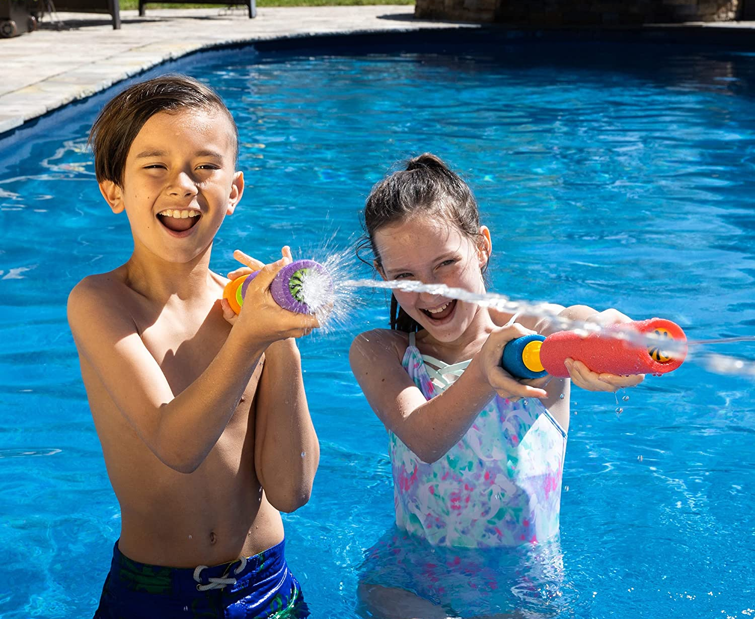 Children models spraying water from the foam blasters